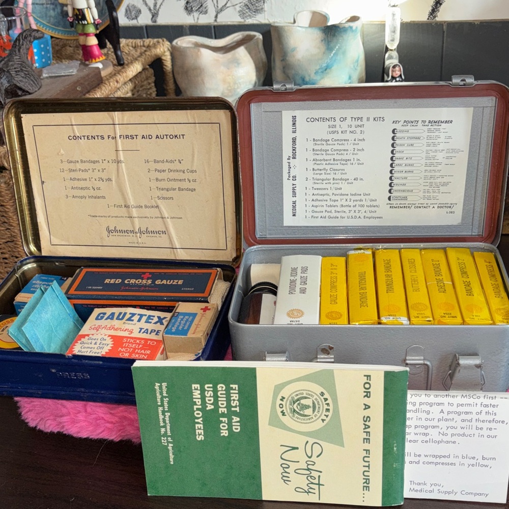 VINTAGE SET OF 2 FIRST AID KITS. Both sets come in a metal case. Original